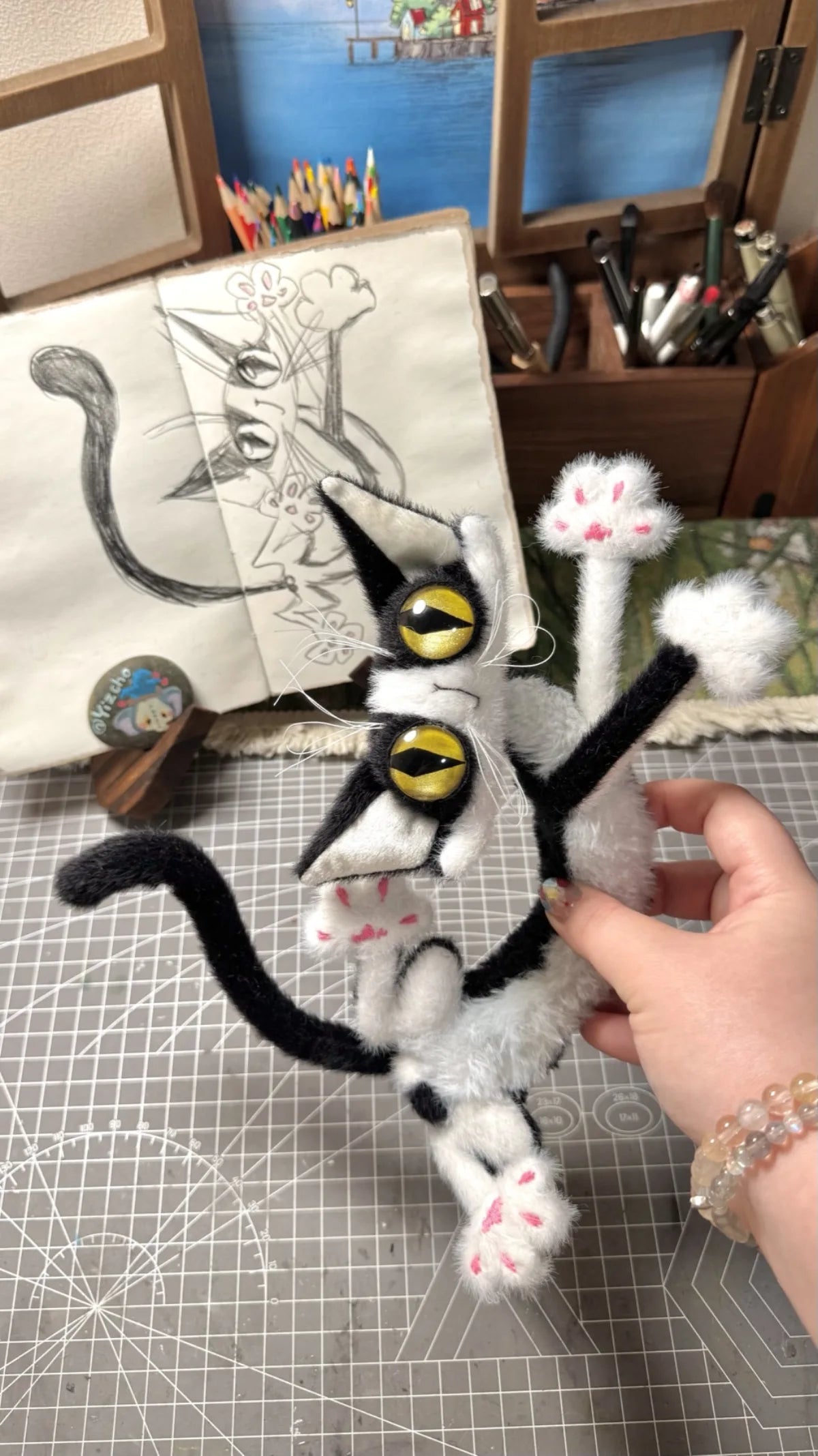 Handmade stacked black and white cat plush charm prototype